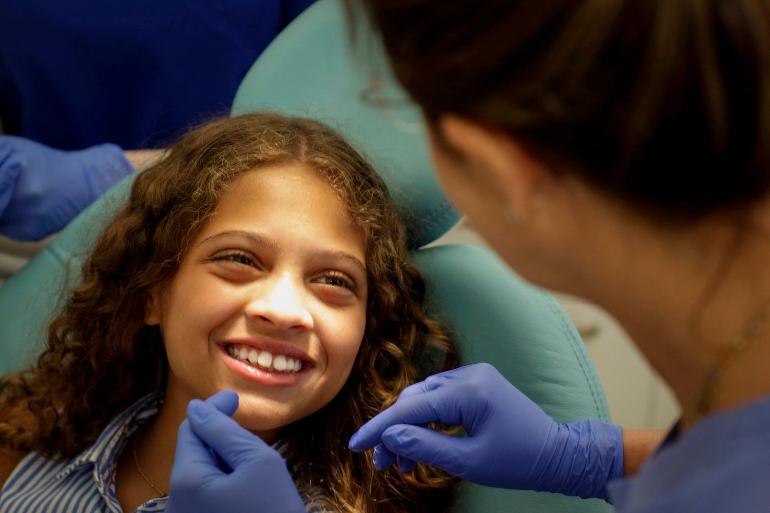 Young patient smiling during a gentle dental check-up at Campos Dental Edgware
