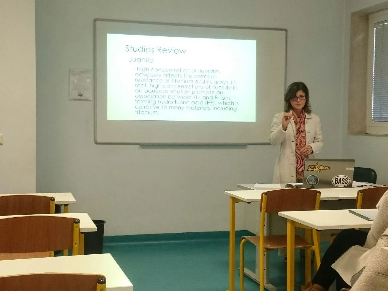 Dr Jacqueline Jacobs presenting a clinical studies review during her Master's in Dental Medicine at Fernando Pessoa University.